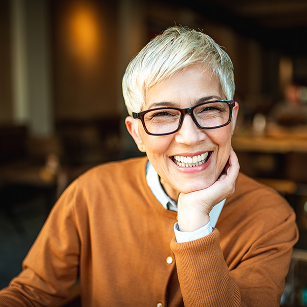 Happy woman smiling showing her teeth