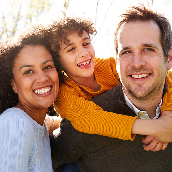 Happy family smiling having fun outdoors