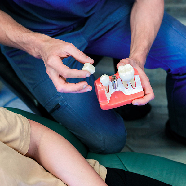Dentist from Minnesota Dental Surgery and Implant Center explaining dental implants to patient
