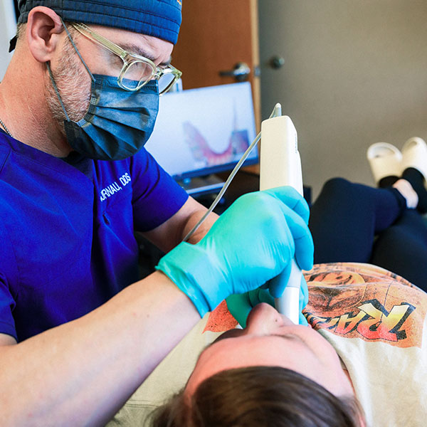 Dentist from Minnesota Dental Surgery and Implant Center performing surgery on patient