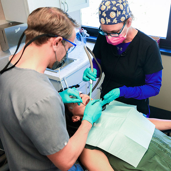 Dentist from Minnesota Dental Surgery and Implant Center performing surgery on patient