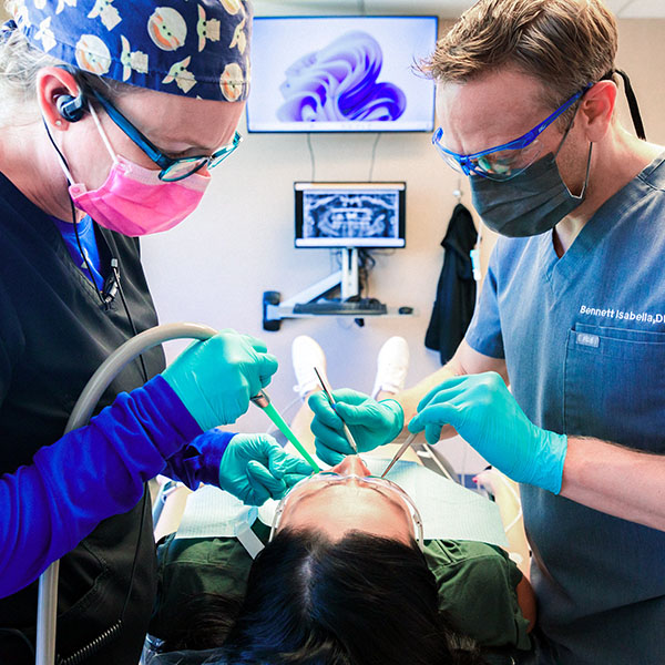 Dentist from Minnesota Dental Surgery and Implant Center performing surgery on a patient